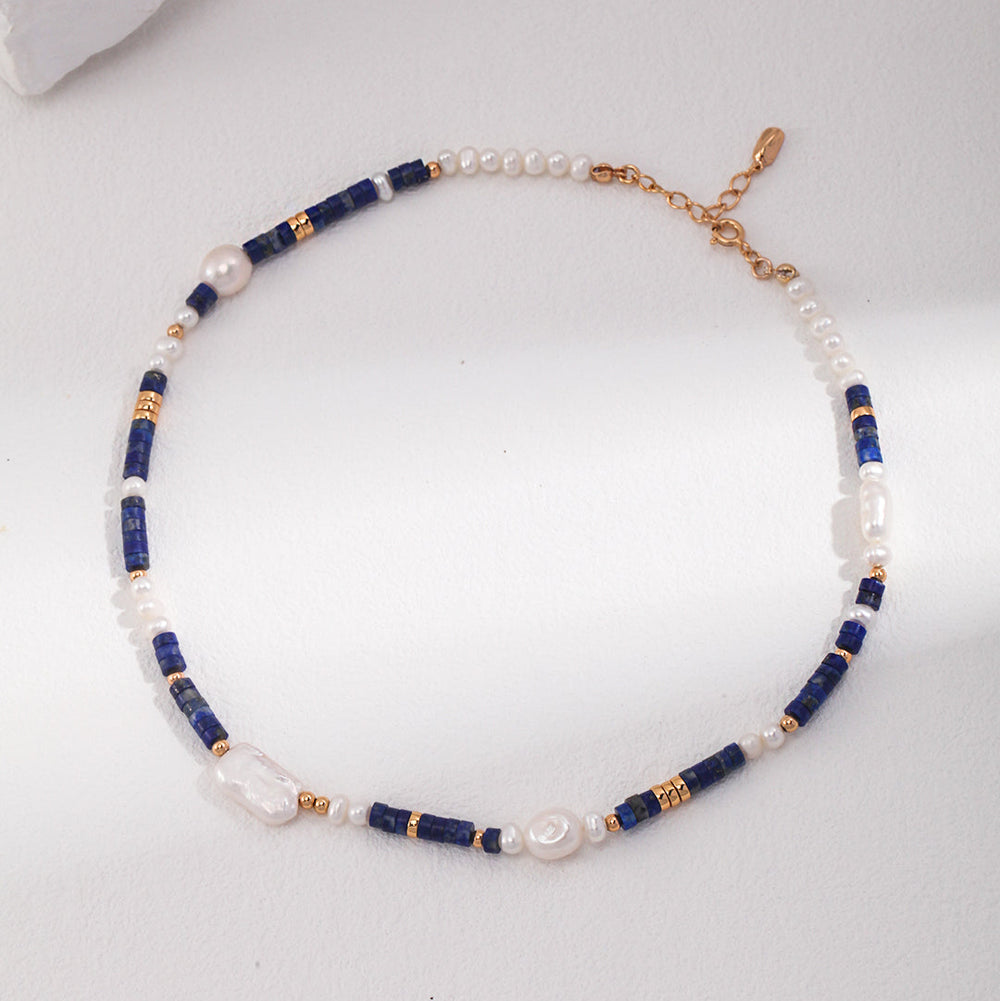 Necklace with blue and gold beads on a white background