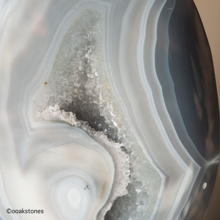 Close-up of natural agate banding and sparkling druzy quartz cavity