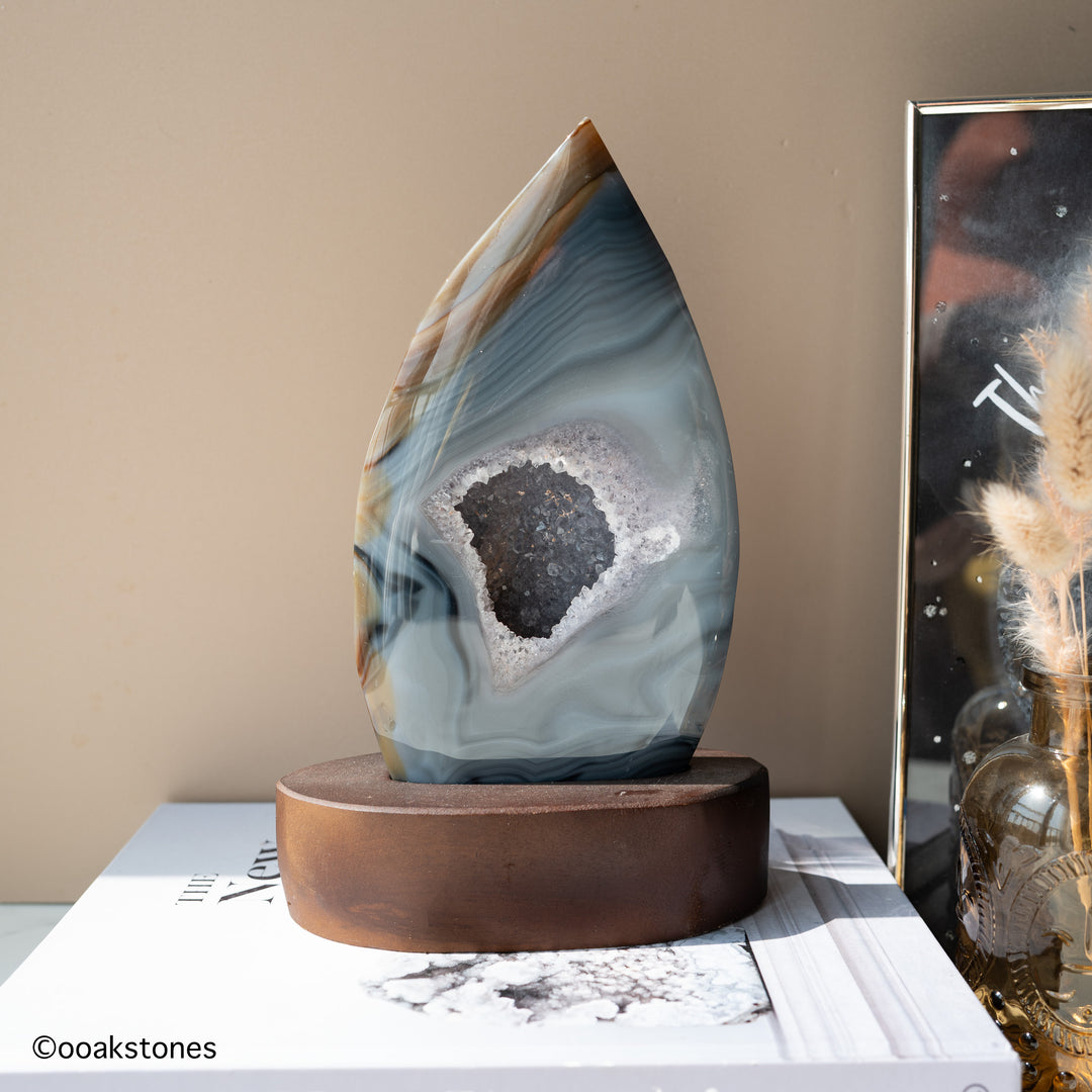 Madagascar natural agate flame sculpture displayed on custom-made wooden base