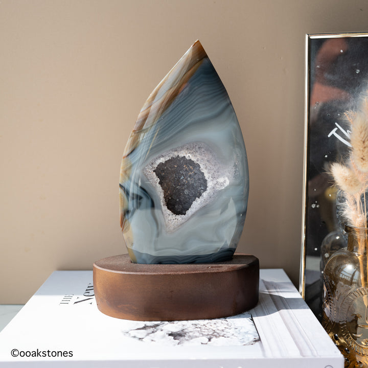 Madagascar natural agate flame sculpture displayed on custom-made wooden base
