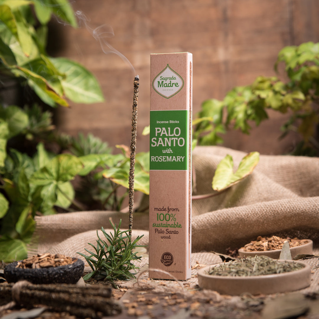 Palo Santo with rosemary incense stick with packaging on a natural setting with plants