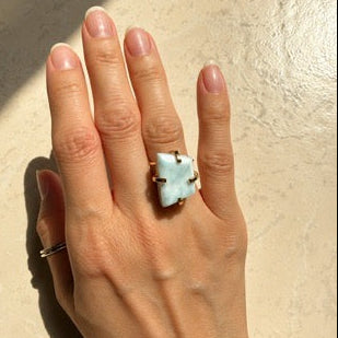 Adjustable larimar ring on hand