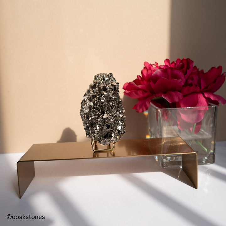 Peruvian Pyrite crystal specimen displayed on a stand