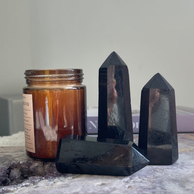 Black tourmaline point styled with a candle
