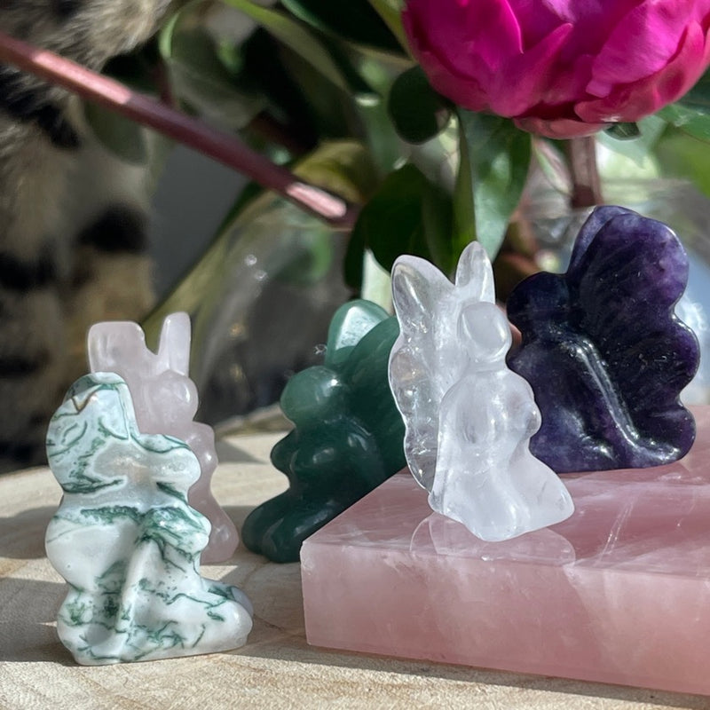 Crystal Fairies displayed on rose quartz slab