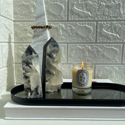 2 Calcite tower styled with a mirror tray and a white candles