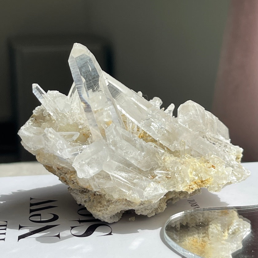 Water clear nepalese clear quartz clusters with visible striations and rainbow on crystal faces