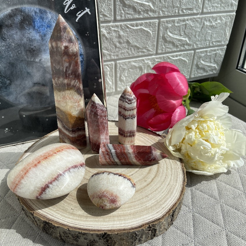 Dali Jasper, aka, rainbow calcite displayed on wooden tray