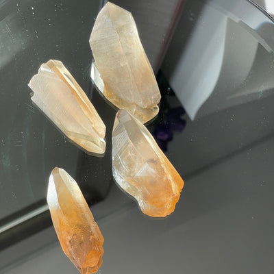 Champagne yellow citrine lemurian placed on mirror